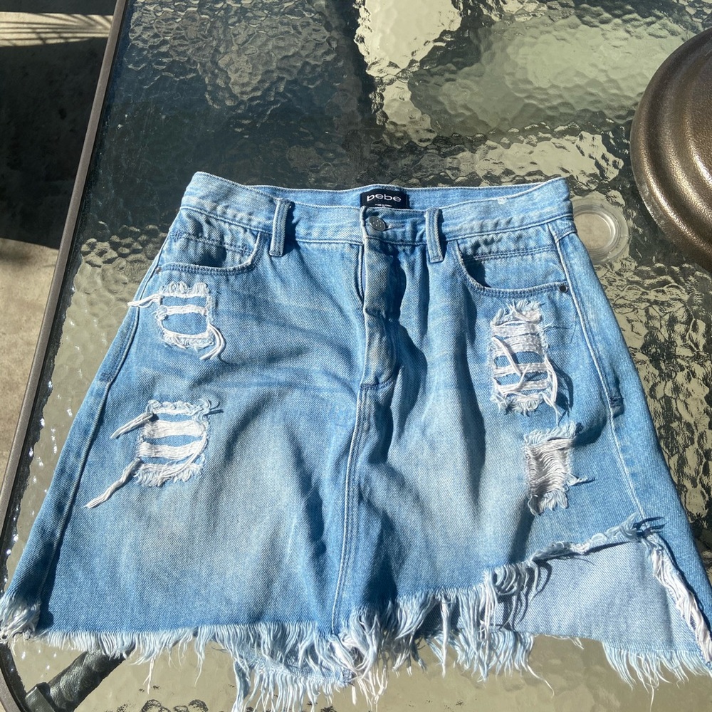 Bebe distressed asymmetrical denim skirt